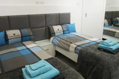 a room with two beds with towels on them at Sky Star Villa 25 in Hurghada