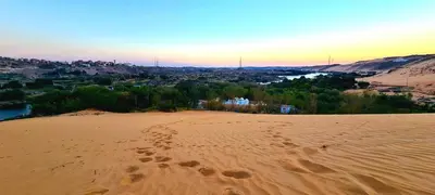 a view of a desert with footprints in the sand at Nubian Farm Aswan in Aswan