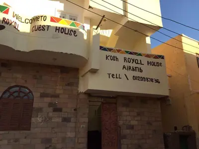 a building with signs on the side of it at Kosh royal house in Aswan