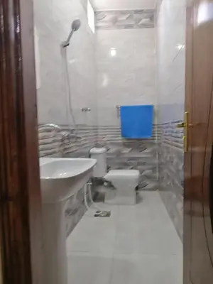 a bathroom with a sink and a toilet at Kosh royal house in Aswan