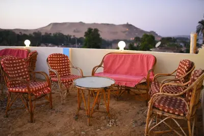 a group of chairs and a table on a balcony at Kosh royal house in Aswan