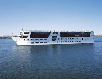 a large white boat floating on the water at Jaz Celebrity Nile Cruise - Every Saturday from Luxor for 07 & 04 Nights - Every Wednesday From Aswan for 03 Nights in Luxor