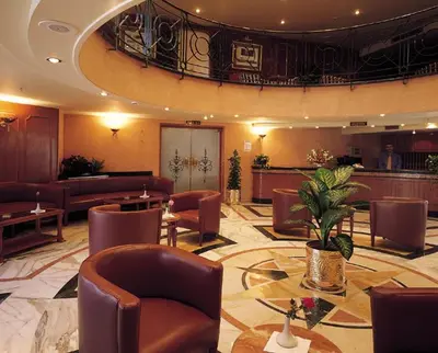 a lobby with chairs and tables in a hotel at Jaz Celebrity Nile Cruise - Every Saturday from Luxor for 07 & 04 Nights - Every Wednesday From Aswan for 03 Nights in Luxor