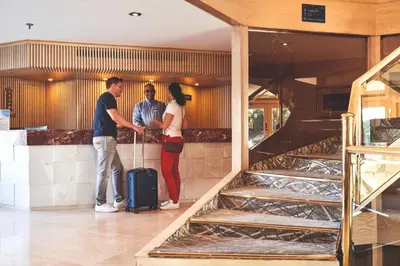 a group of three people standing next to a counter at JAZ Imperial Nile Imperial Cruise - Every Thursday from Luxor- Aswan- Luxor for 07 Nights in Luxor