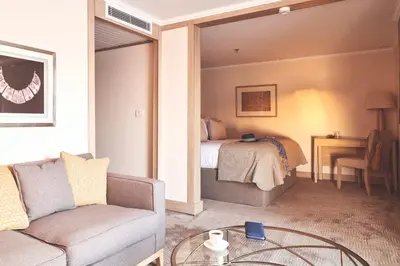 a living room with a couch and a bed at JAZ Imperial Nile Imperial Cruise - Every Thursday from Luxor- Aswan- Luxor for 07 Nights in Luxor