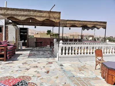 a pavilion with a table and chairs on a patio at Luxor hotel Bella Vista Apartments and Hotel in Luxor