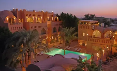 an aerial view of a building with a swimming pool at Malkata House - Boutique hotel and restaurant in Luxor
