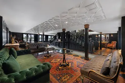 a living room with couches and tables in a building at Movenpick SS Misr Steamer Nile Cruise - 04 & 07 Nights Each Monday From Luxor and 03 Nights Each Friday from Aswan in Luxor