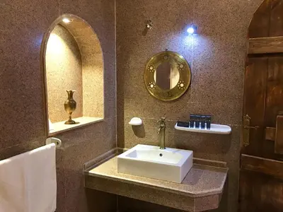 a bathroom with a sink and a mirror at Djorff Palace in Luxor