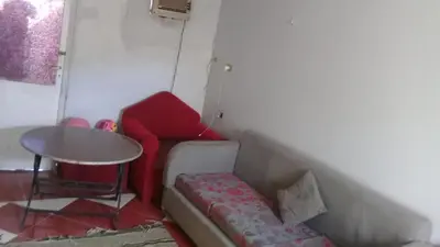 a living room with a couch and a table at Elephantina sobek guest house in Aswan