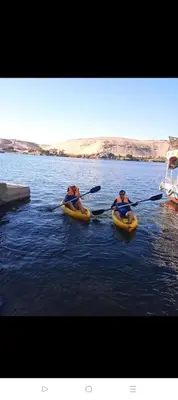 two people in kayaks on a body of water at Elephantina sobek guest house in Aswan