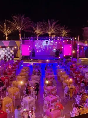 a group of people sitting in a room with purple lights at TUI MAGIC LIFE Kalawy in Hurghada