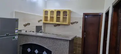 a kitchen with a counter and a yellow cabinet at DREAM ISLAND Hotel in Luxor