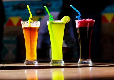 three different types of drinks sitting on a table at Opal privat nubian hotel in Aswan