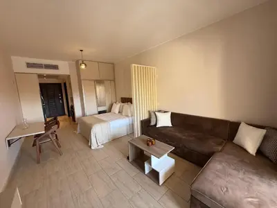 a living room with a couch and a bed at Luxury Hurghada Self-Catering Apartments & Studios, Al Dau Heights in Hurghada