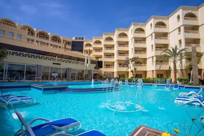 a swimming pool in front of a resort at AMC Royal Hotel & Spa in Hurghada