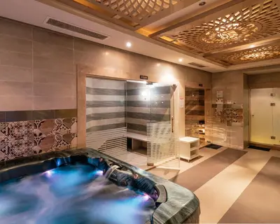 a jacuzzi tub in a large room with at AMC Royal Hotel & Spa in Hurghada