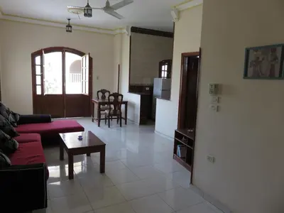 a living room with a couch and a table at Hermina Guest House in Luxor