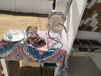 a table with a plate of chocolates on it at Roma House in Aswan
