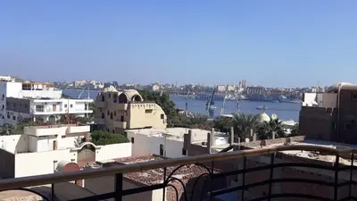 a view of a city with buildings and a harbor at New Modern Flats in Luxor