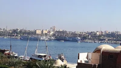 a view of a harbor with boats in the water at New Modern Flats in Luxor