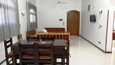 a dining room with a table and chairs at New Modern Flats in Luxor