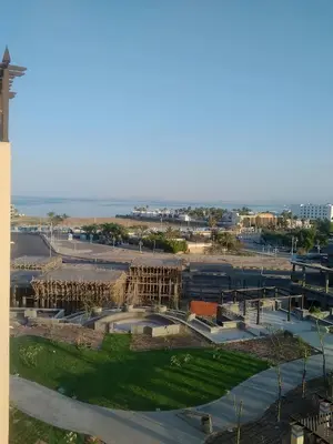 an aerial view of a park with the ocean in the background at Awesome Pool View Studio in Al Dau Heights in Hurghada