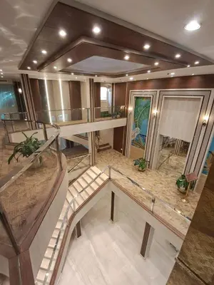 a large room with a spiral staircase in a building at MS Chateau Lafayette Nile Cruise - 4 nights from Luxor each Monday and 3 nights from Aswan each Friday in Luxor
