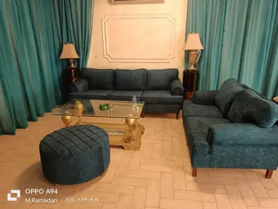 a living room with two couches and a coffee table at Villa with Private Pool in Hurghada