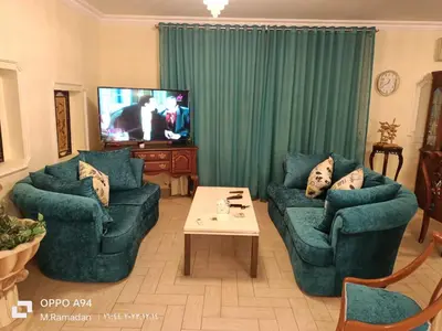 a living room with two couches and a tv at Villa with Private Pool in Hurghada