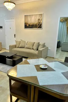 a living room with a couch and a table at Karnak Flats in Luxor