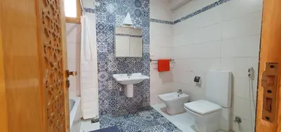 a bathroom with a toilet and a sink at Dar Lina Guesthouse Luxor in Luxor