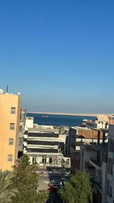 a view of a city with buildings and the ocean at Sea View Apartment at Sheraton Road 2 bed rooms in Hurghada