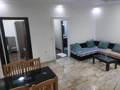 a living room with a couch and a table at Sea View Apartment at Sheraton Road 2 bed rooms in Hurghada