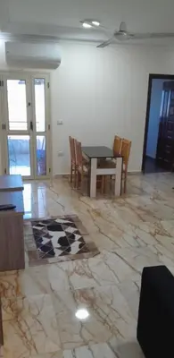 a dining room with a table and chairs at Sea View Apartment at Sheraton Road 2 bed rooms in Hurghada