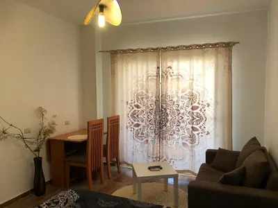 a living room with a couch and a table at Studio Florenza Khamsin in Hurghada