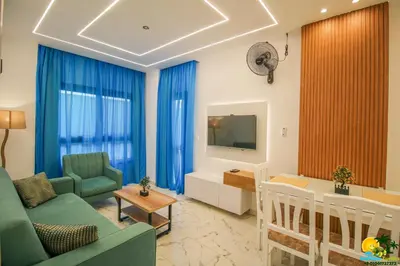 a living room with a couch and a dining room at BeachView Turtles in Hurghada