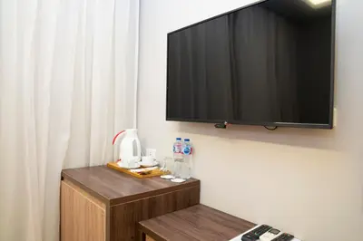 a flat screen tv hanging on a wall at Al Dora Boutique Hotel in Hurghada