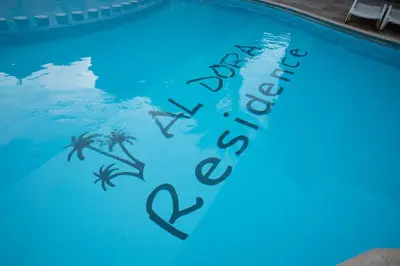 a swimming pool with the words happy holidays written on it at Al Dora Boutique Hotel in Hurghada