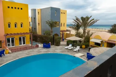 a resort with a swimming pool and the beach at Al Dora Resort Hurghada in Hurghada