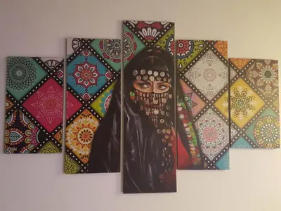 a painting of a woman with a mask on a wall at Spirit Luxor Luxury in Luxor