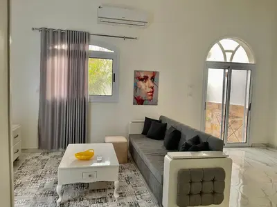 a living room with a couch and a table at Spirit Luxor Luxury in Luxor