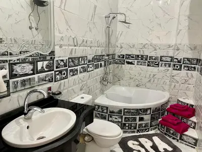 a bathroom with a sink and a toilet and a tub at Spirit Luxor Luxury in Luxor