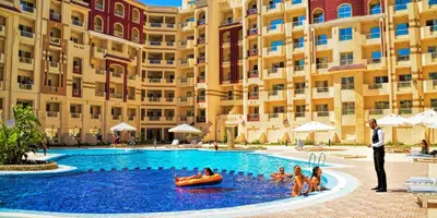 a group of people in a pool at a hotel at Apartment I in Florenza Khamsin in Hurghada