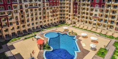 an aerial view of a large building with a swimming pool at Apartment I in Florenza Khamsin in Hurghada