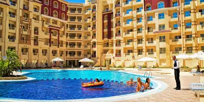 a group of people in a pool at a hotel at Apartment I in Florenza Khamsin in Hurghada