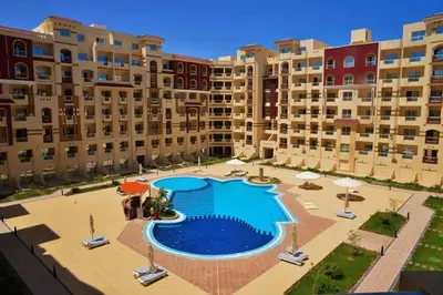 an overhead view of a swimming pool in a building at Apartment F in Florenza Khamsin in Hurghada