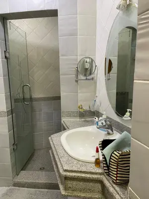 a bathroom with a sink and a mirror at Beachfront Cozy One Bedroom apartment Sahl Hasheesh Palma de Piazza in Hurghada