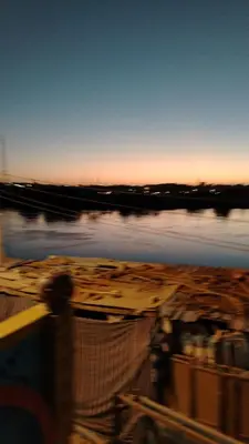 a blurry picture of a boat in the water at NeNeKaTo Nubian House in Aswan