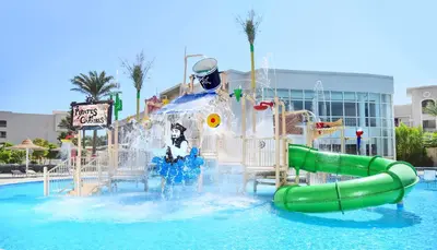 a water park with a water slide in the water at JAZ Soma Beach in Hurghada
